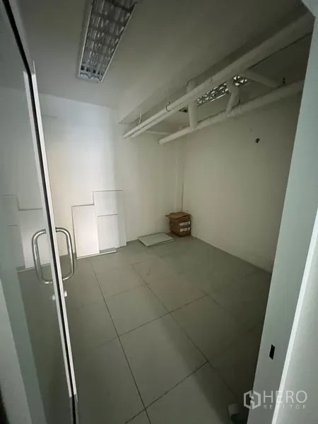 Retail Space for rent in Bang Rak, Bangkok - Enclosed office or meeting room with a glass door and exposed beams.