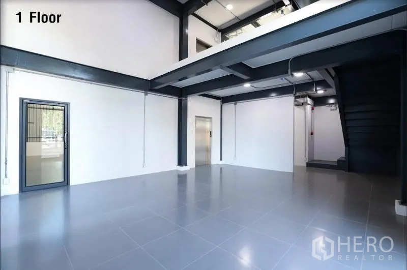 Warehouse for rent in Wang Thonglang, Bangkok - Ground floor open office or showroom with mezzanine, lift and staircase.