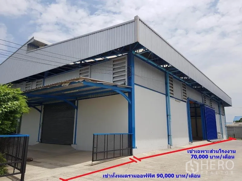Factory for rent in Samut Sakhon - Street-facing view of the factory warehouse with two roller doors and gated loading area.