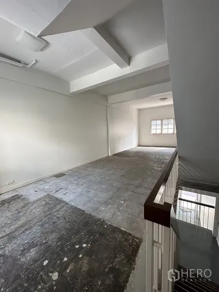Retail Space for rent in Watthana, Bangkok - Open-plan upper floor with exposed beams and natural light from rear window.