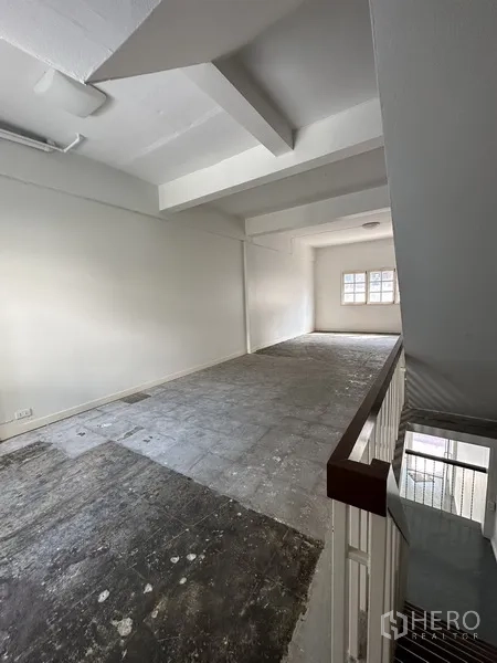 Retail Space for rent in Watthana, Bangkok - Open-plan upper floor with exposed beams and natural light from rear window.