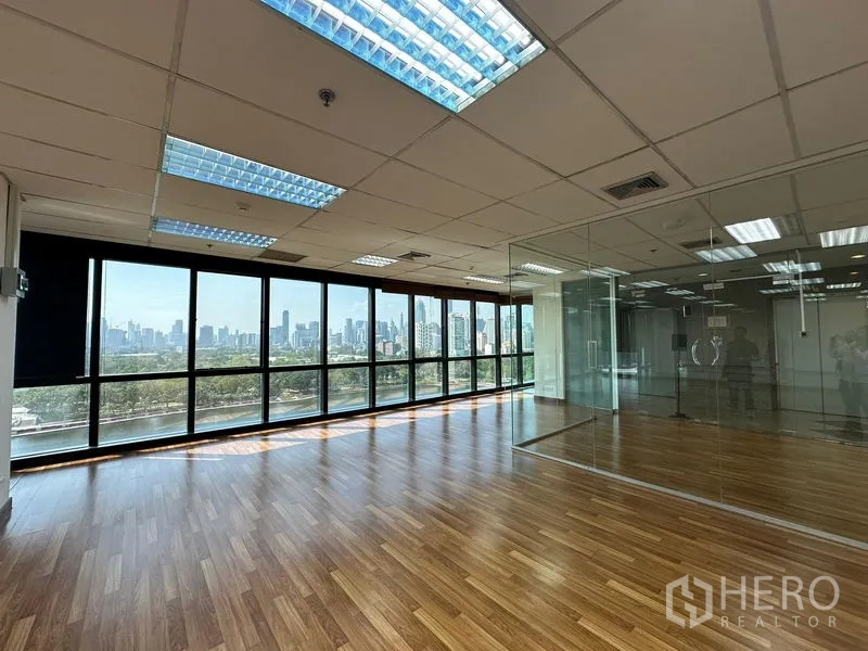 Office Space for rent in Watthana, Bangkok - Bright office with panoramic windows overlooking Benjakitti Park and the skyline.