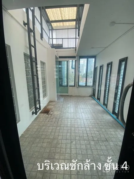Shophouse for rent in Watthana, Bangkok - Covered utility terrace with skylight, ladder and tiled floor.