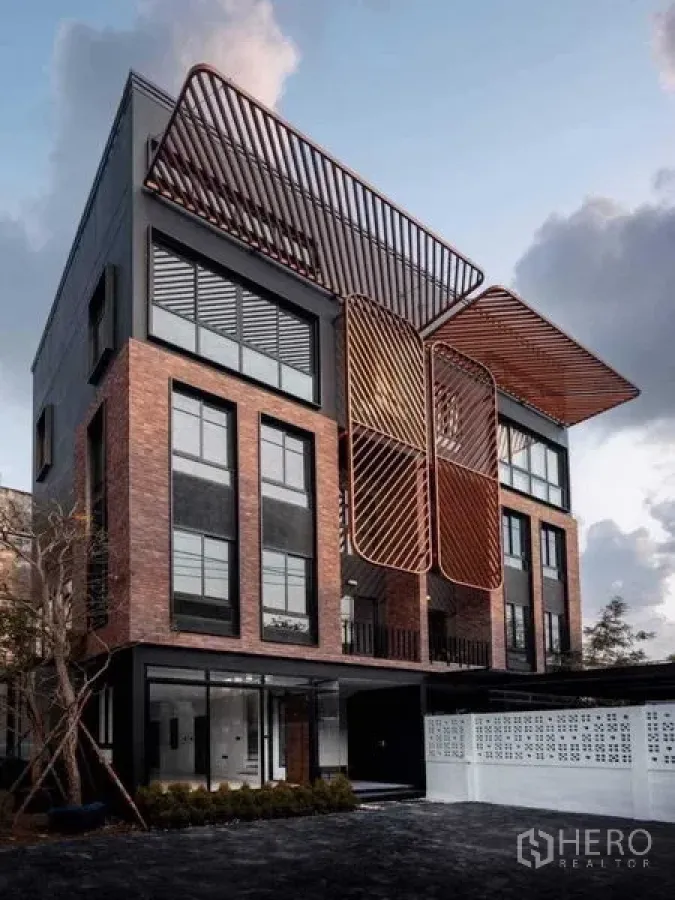 Home Office for sale in Lat Phrao, Bangkok - Modern brick-and-black facade of a multi-storey home office building.