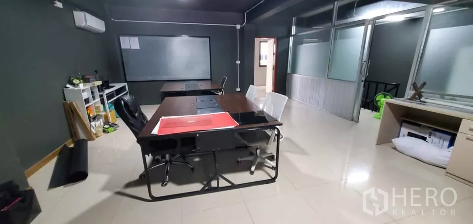 Office Space for rent in Suan Luang, Bangkok - Office area with desks, chairs, whiteboard and frosted glass partitions.
