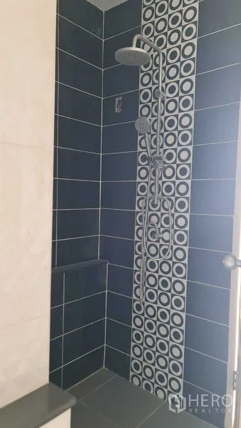 Townhouse for  in Lam Luk Ka, Pathum Thani - Bathroom shower with blue wall tiles and patterned accent strip plus rain shower.