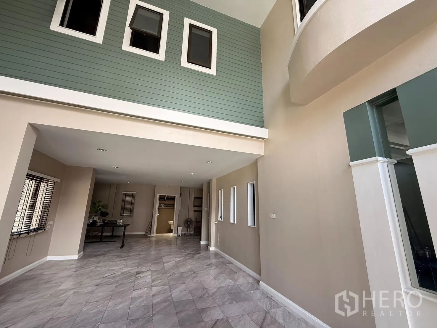Home Office for rent in Wang Thonglang, Bangkok - Lobby view showing mezzanine level and interior windows above.