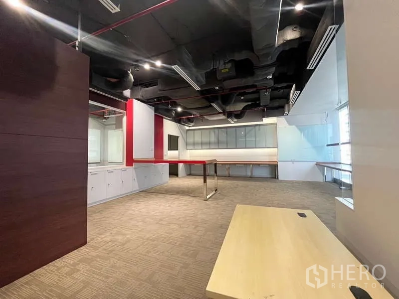 Office Space for rent in Watthana, Bangkok - Compact pantry with white cabinets, countertop and overhead storage with task lighting.