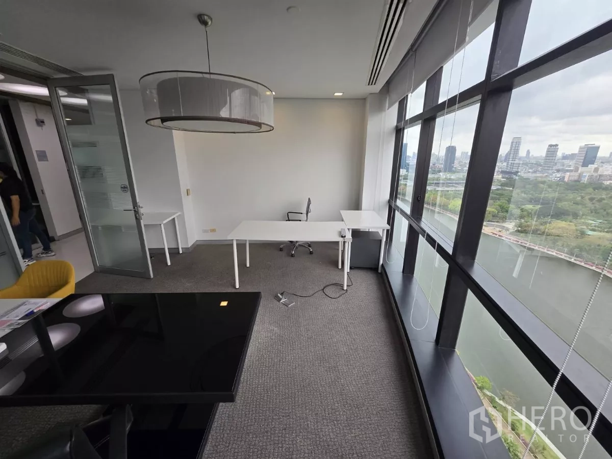 Office Space for rent in Watthana, Bangkok - Private office with pendant light, large windows and neutral décor.