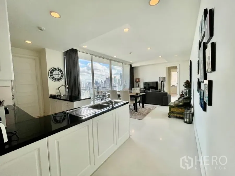 Condominium for sale in Watthana, Bangkok - Bright kitchen-dining layout with full-height glass and skyline balcony