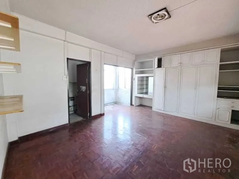 Retail Space for rent in Sathon, Bangkok - Parquet-floored room with built-in white cabinetry and a work desk.