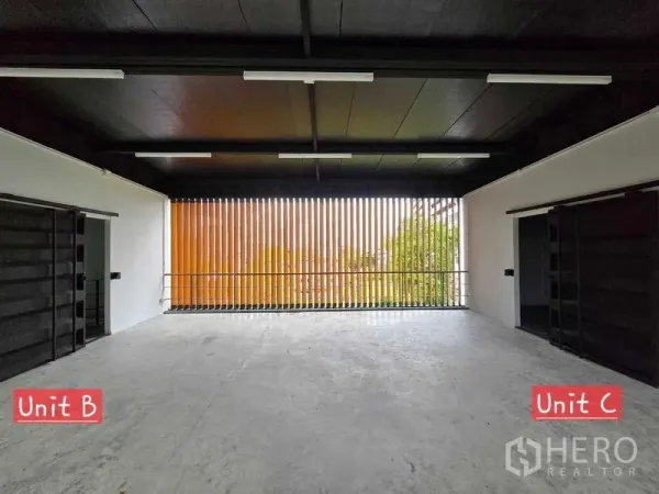 Home Office for rent in Chatuchak, Bangkok - Open-plan home office floor with black ceiling and vertical orange slat screen bringing in natural light.