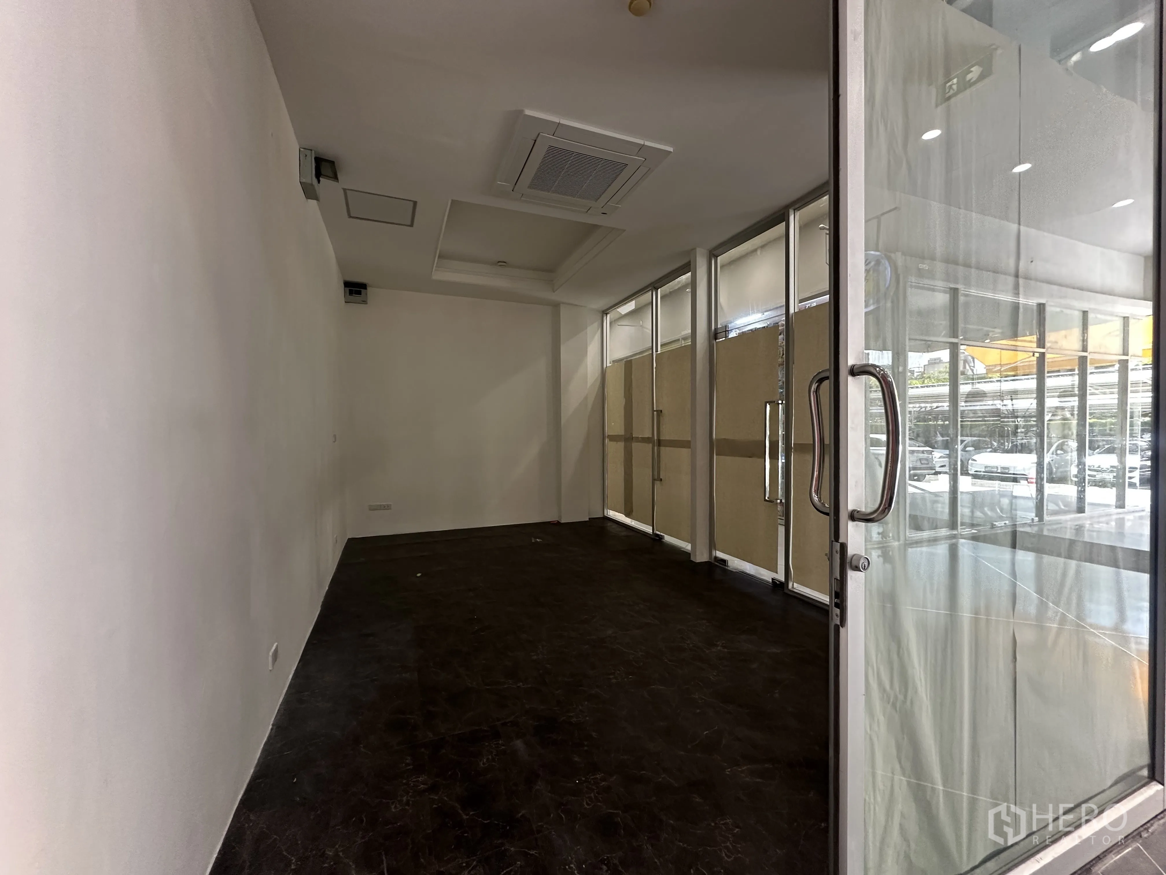 Retail Space for rent in Khlong Toei, Bangkok - Entrance with double glass doors opening to a compact shop and glazed frontage.
