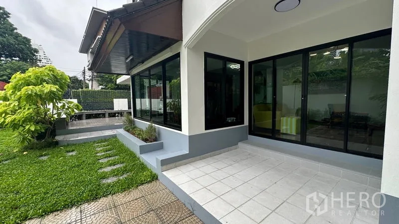 Detached House for rent in Watthana, Bangkok - Terrace with sliding glass doors connecting to the garden.