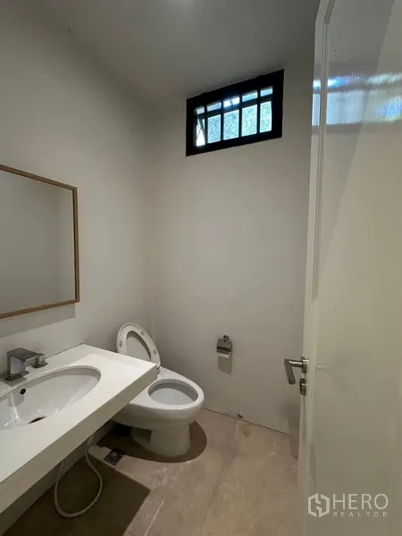 Home Office for rent in Phra Khanong, Bangkok - Deep gallery-like room with wood floors and rows of spotlights.