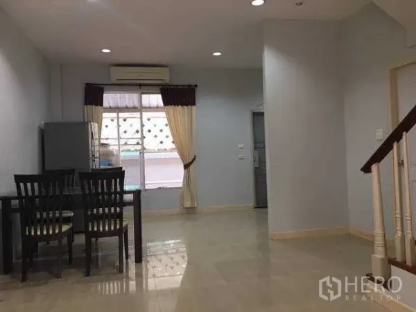 Home Office for rent in Wang Thonglang, Bangkok - Open-plan living and dining area with tiled floors, dining set and curtained window in a Wang Thonglang, Bangkok home office.