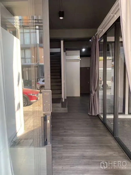 Home Office for rent or sale - Ground floor corridor with digital door lock, sliding glass panels and street view.