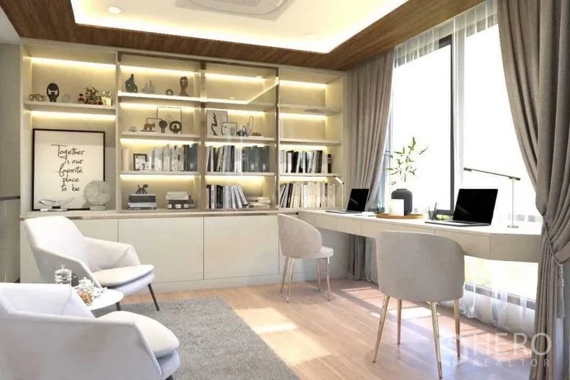 Townhouse for sale in Suan Luang, Bangkok - Library-style study with illuminated shelves and twin desks.