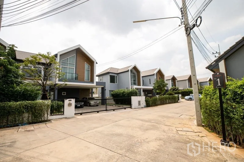 Detached House for rent or sale in Lam Luk Ka, Pathum Thani - Ground-floor room with glossy tile floor and a large window with curtains.