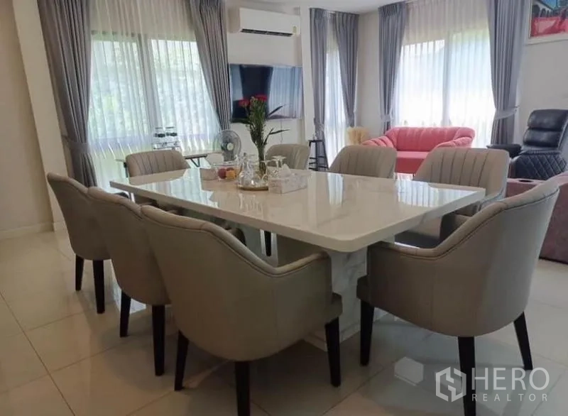 Detached House for rent - Open dining area featuring a marble table and six upholstered chairs by full‑height windows.