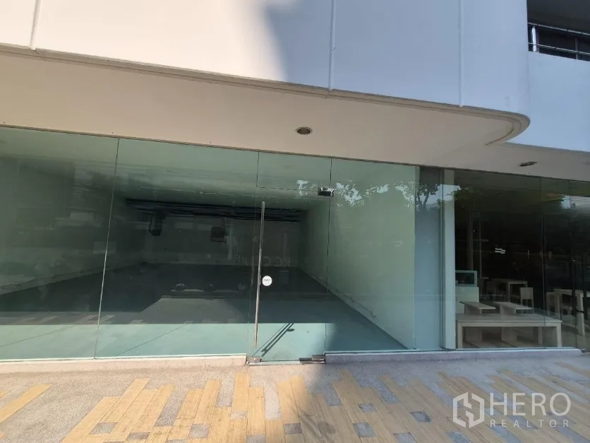 Retail Space for rent in Watthana, Bangkok - Ground-floor retail unit with full-height glass facade and a single glass door, ready for signage.