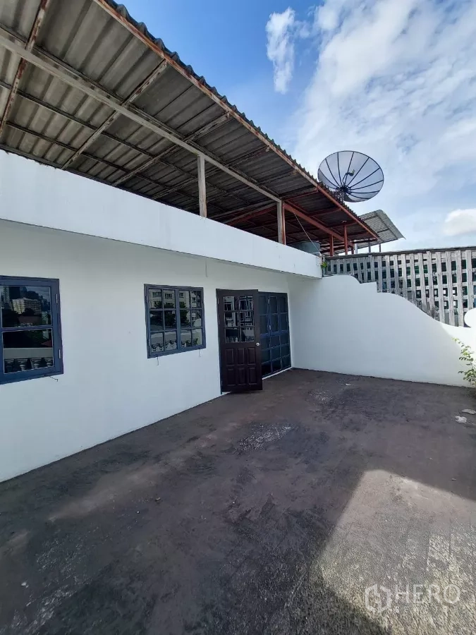 Home Office for rent in Yan Nawa, Bangkok - Rooftop terrace with partial roof cover and satellite dish.