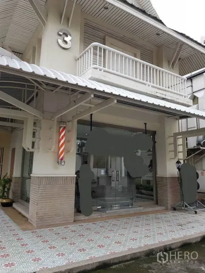 Retail Space for rent in Watthana, Bangkok - Two‑storey shophouse exterior with glass double doors, balcony and a covered walkway.
