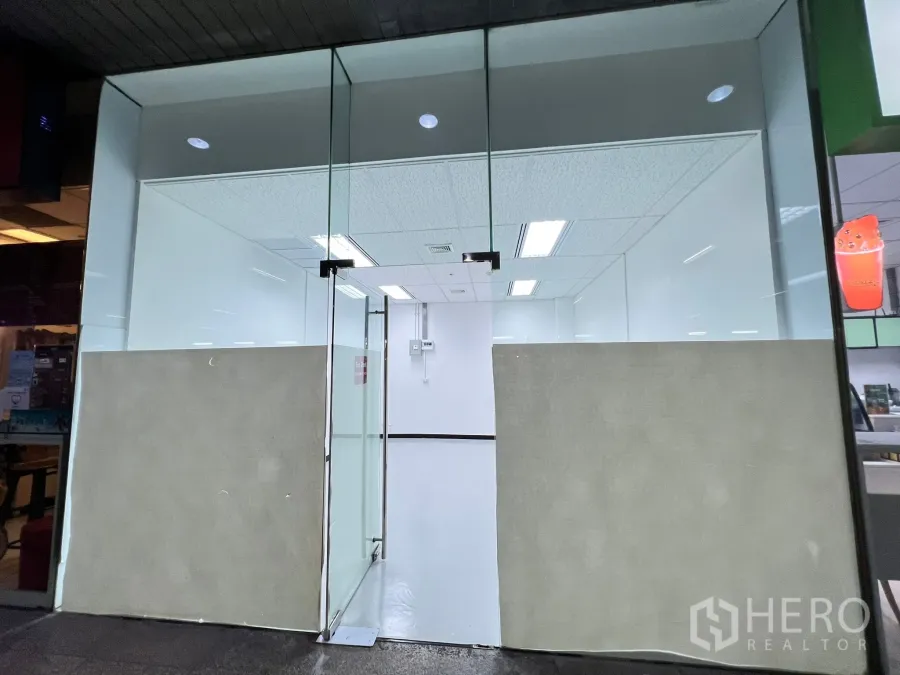 Retail Space for rent in Watthana, Bangkok - Glass-walled shopfront with double doors and bright interior lighting.