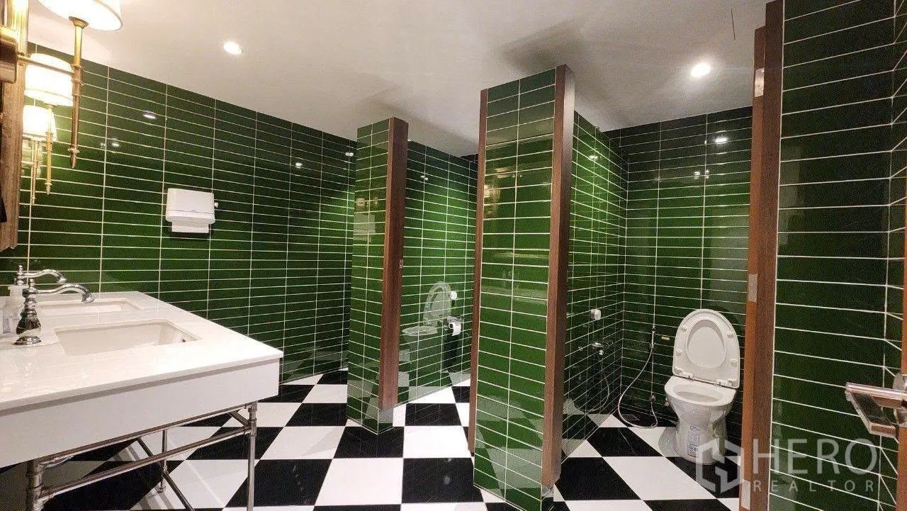Home Office for rent in Lat Phrao, Bangkok - Green tiled multi-stall restroom with checkerboard floor.