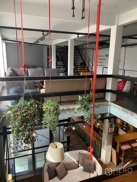 Retail Space for rent in Bang Na, Bangkok - Hanging plants over the atrium beside a mezzanine rail