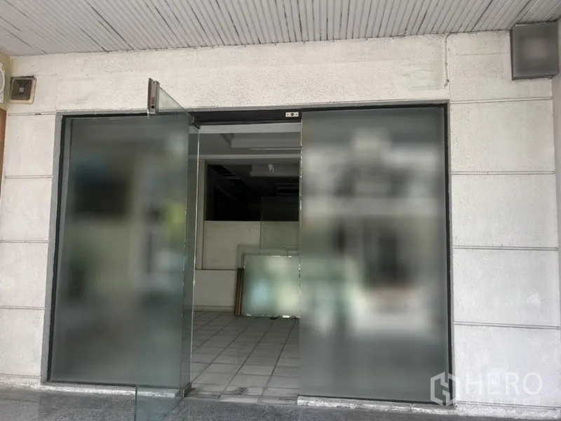 Retail Space for rent in Watthana, Bangkok - Wide glass entrance doors opening to a tiled retail space.
