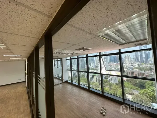 Office Space for rent - Bright office zone with long window wall and internal glass partitions overlooking the city.