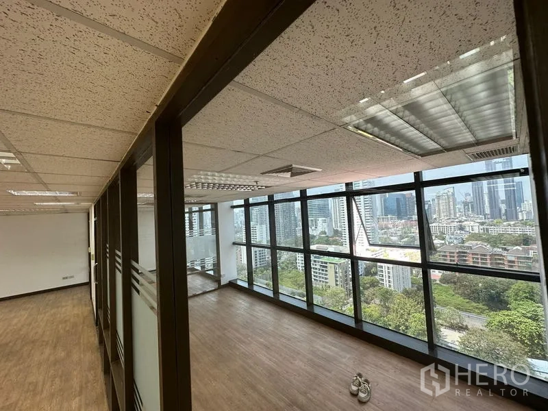 Office Space for rent - Bright office zone with long window wall and internal glass partitions overlooking the city.