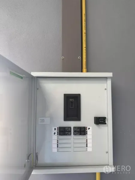 Warehouse for rent in Bang Phli, Samut Prakan - Close-up of the warehouse electrical breaker panel with clearly labeled switches and conduit.