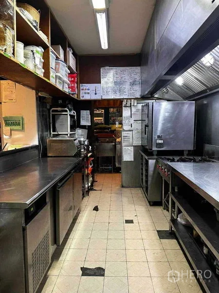 Retail Space for rent in Watthana, Bangkok - Professional kitchen corridor with ovens, cooktops and ventilation hood.