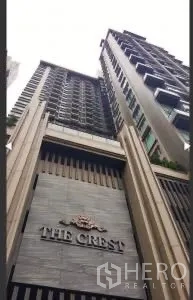 Condominium for rent or sale in Khlong Toei, Bangkok - High-rise facade of The Crest condominium viewed from street level.