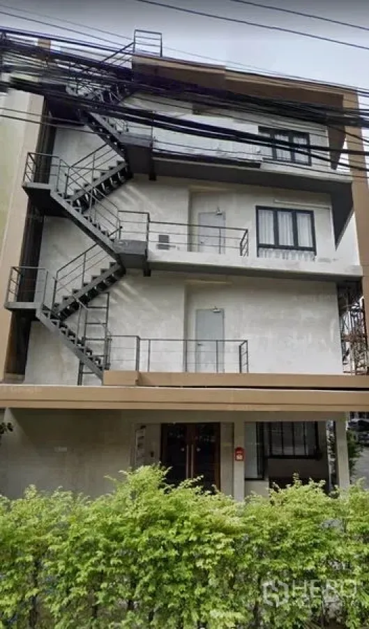 Office Space for rent in Phra Khanong, Bangkok - Four-storey office building exterior with metal fire-escape stairs and greenery in Phra Khanong