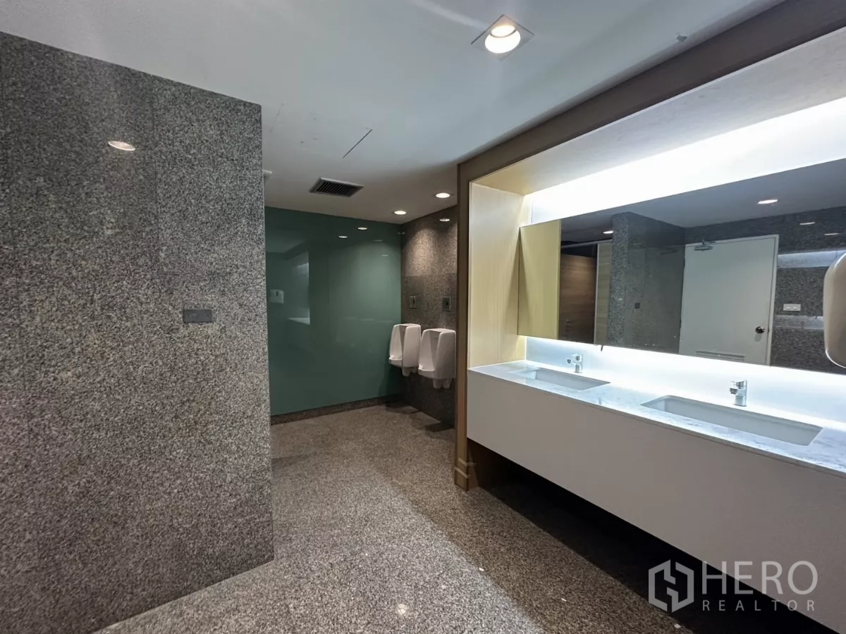 Office Space for rent in Watthana, Bangkok - Modern men’s restroom with granite finishes and double vanity.