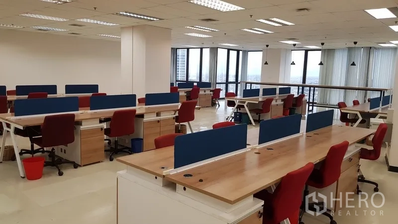 Office Space for rent in Din Daeng, Bangkok - Wide view of co-working style desks near corner windows with city outlook.