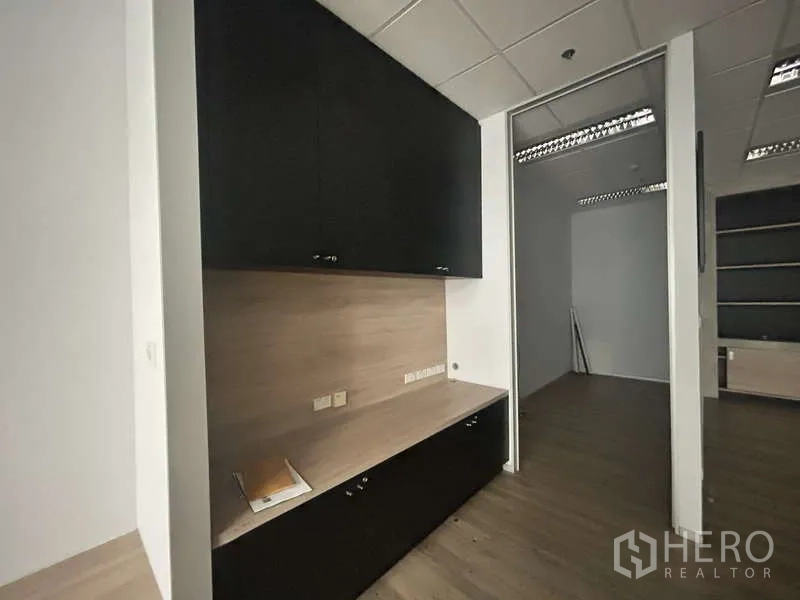 Office Space for rent - Built-in storage cabinets and work counter in neutral tones
