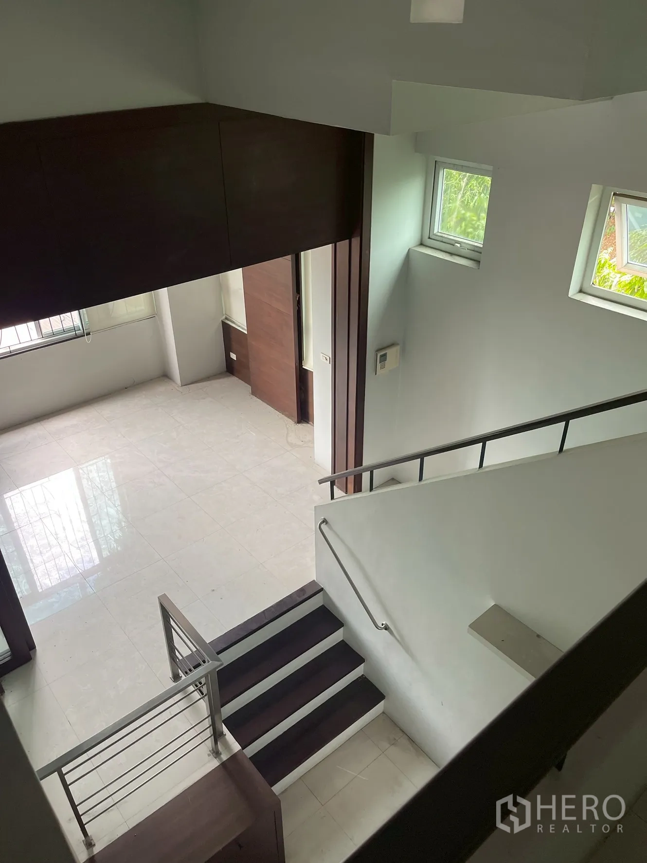 Home Office for rent in Wang Thonglang, Bangkok - Upper-floor overlook to workspace with short steps and side windows.