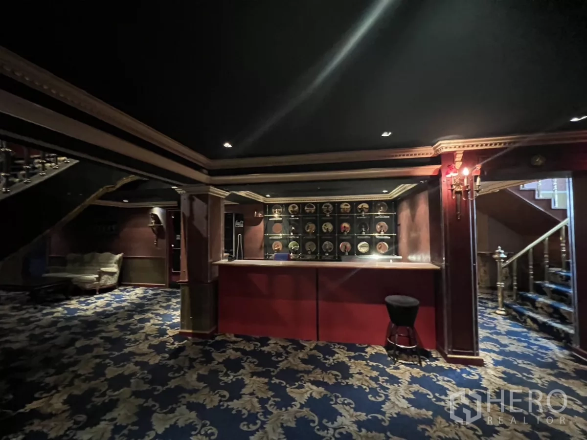 Retail Space for rent in Watthana, Bangkok - Reception bar area with counter and display wall in a club-style setting.