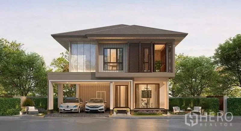 Detached House for sale in Bang Kapi, Bangkok - Modern two-storey detached house exterior with double carport and landscaped frontage in Bang Kapi.