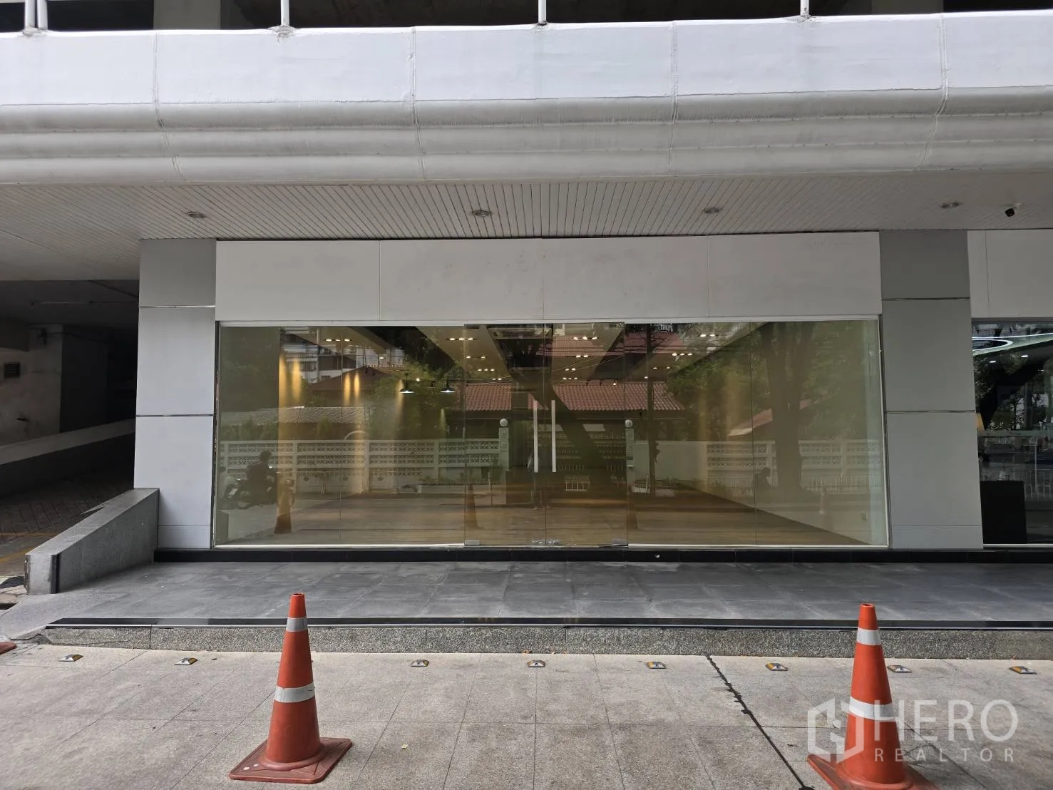 Retail Space for rent in Watthana, Bangkok - Street-facing retail unit with full-height glass storefront and tiled forecourt.