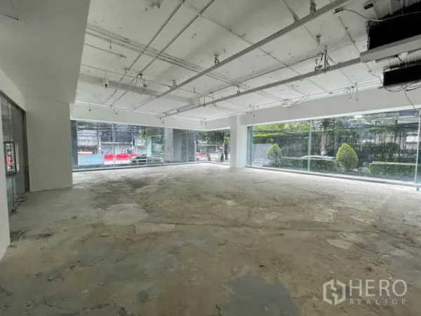 Retail Space for rent in Watthana, Bangkok - Open-plan corner unit with wraparound glass frontage providing abundant natural light.