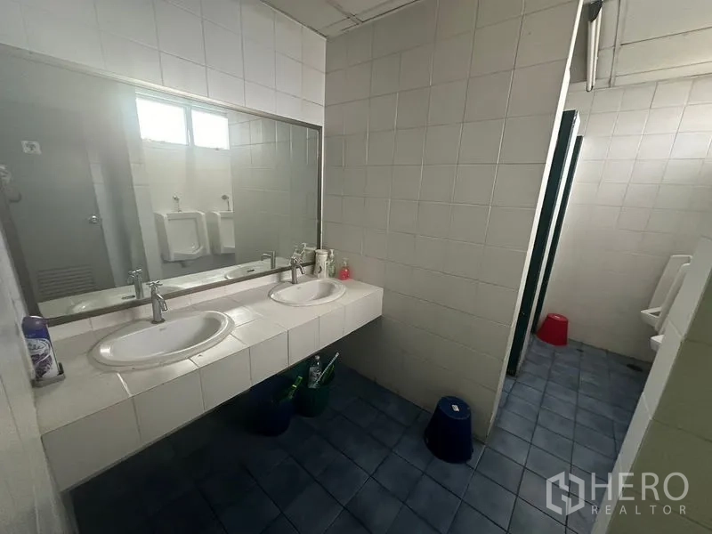 Office Space for rent - Restroom with twin sinks, wide mirror and tiled walls