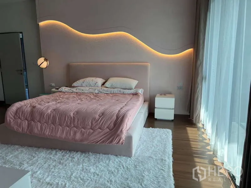 Detached House for rent in Bang Phli, Samut Prakan - Master bedroom with wave LED feature wall and full-height windows.