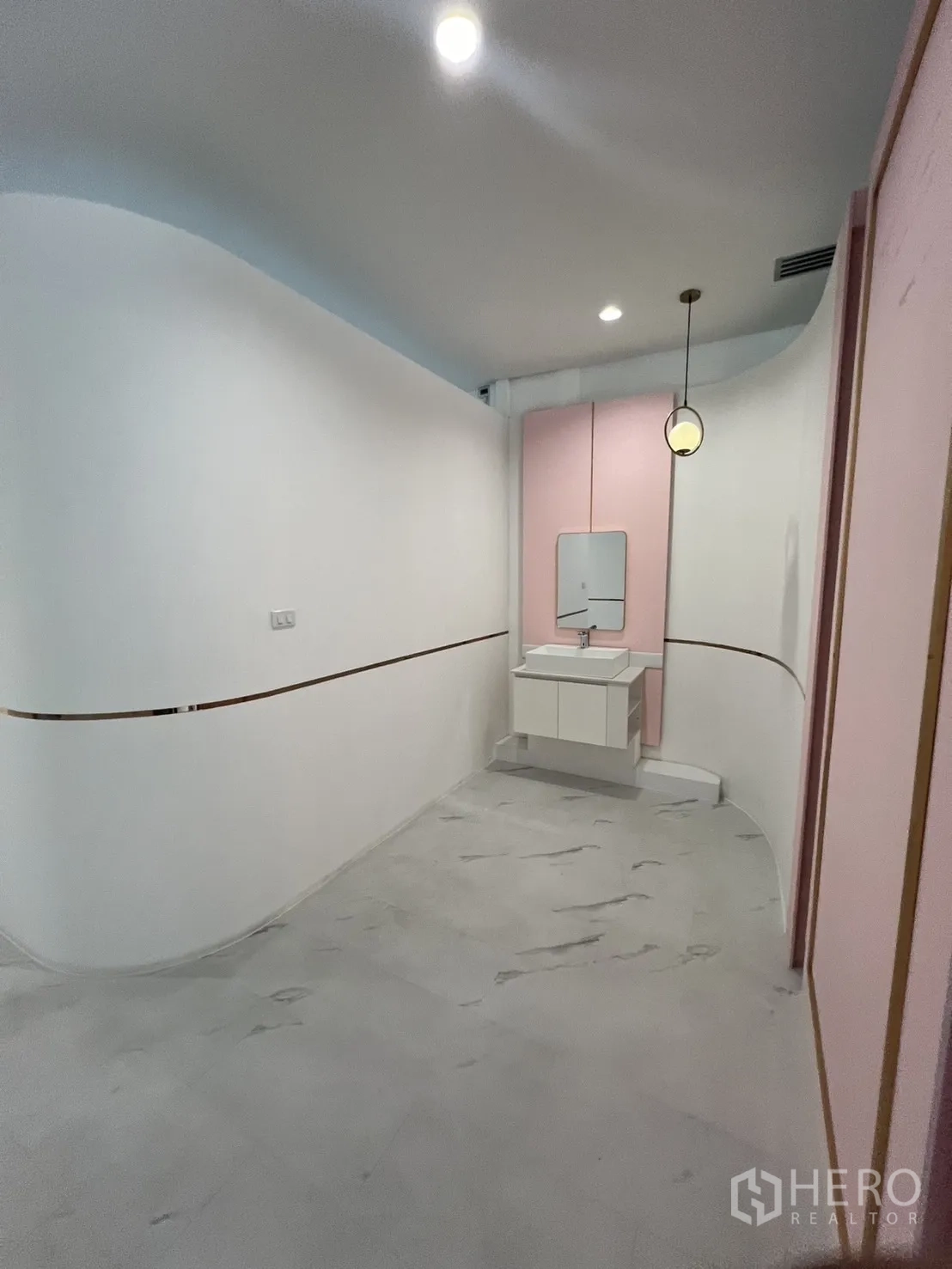 Retail Space for rent in Watthana, Bangkok - Curved corridor with pendant light and a compact washbasin.