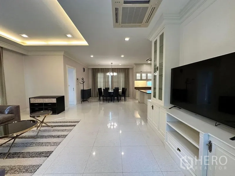 Detached House for rent or sale - View from living area toward dining zone and TV wall with built-in shelves.