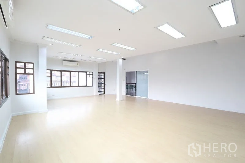Office Space for rent in Bang Na, Bangkok - Large flexible office space with wood floors, suspended lights and a glass meeting room.